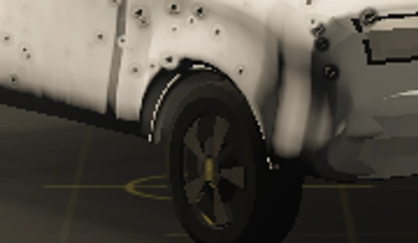 The same magnification after the fix: the front wheel arch lip runs cleanly around the opening and both of its ends stop against the bodywork